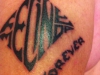 FELINE MELINDA'S LOGO TATTOO on arm of our biggest fan